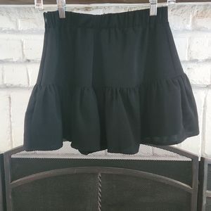 Cute black mini skirt by Impeccable Pig. Zips up the side, great condition!